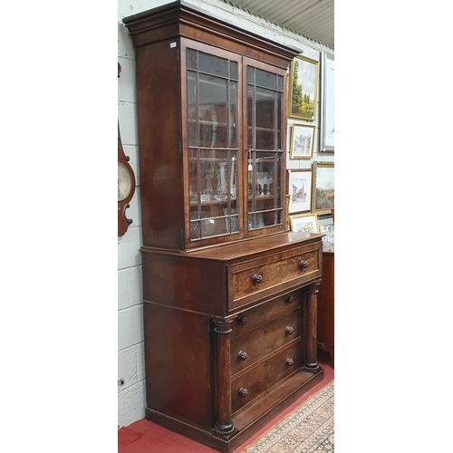 7 - A Regency Mahogany Secretaire Bookcase possibly Irish, with glazed upper section and pillared and dr... 