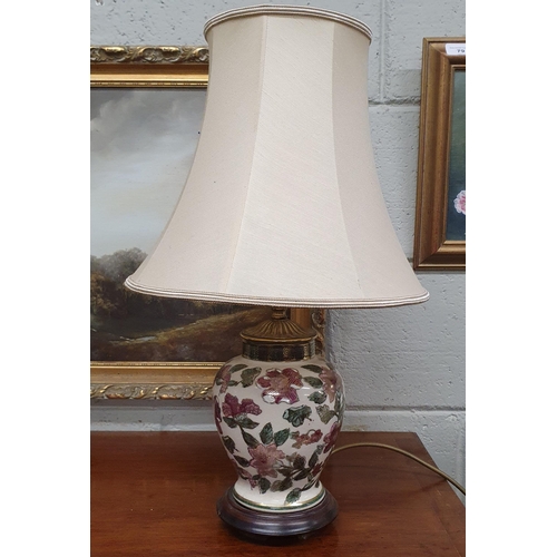 81 - A good bulbous Oriental style Table Lamp with cream ground. H 30 cm approx.