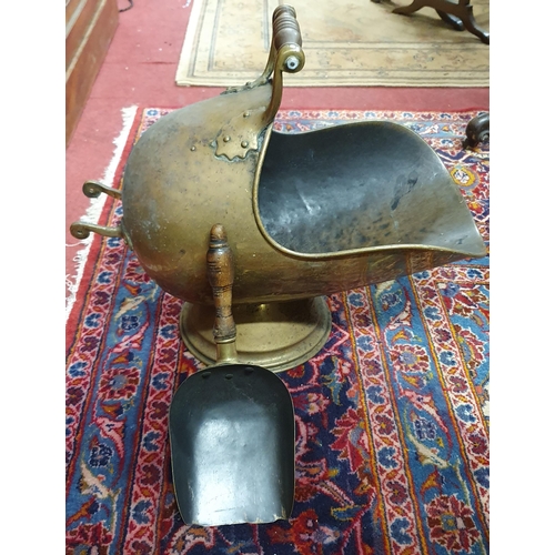 87 - A 19th Century Brass Coal Helmet along with a modern companion set.