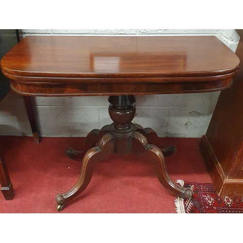 92 - Of Superb quality. An early 19th Century Mahogany fold over Tea Table on turned supports with splaye... 