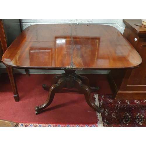 92 - Of Superb quality. An early 19th Century Mahogany fold over Tea Table on turned supports with splaye... 