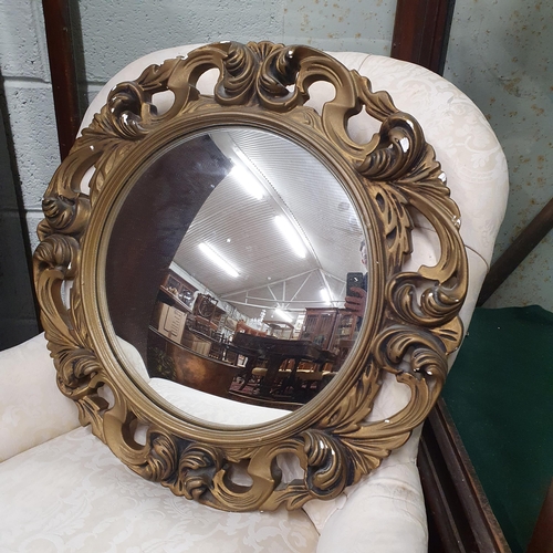 71 - A good Plaster Gilt Mirror with pierced outline and convex glass. D 50 cm approx.