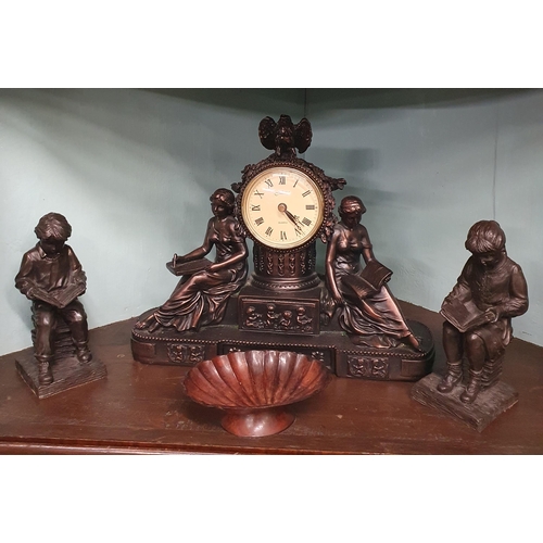 195 - A Bronzed mantle Clock along with two Statues of children sitting reading and a Dish.