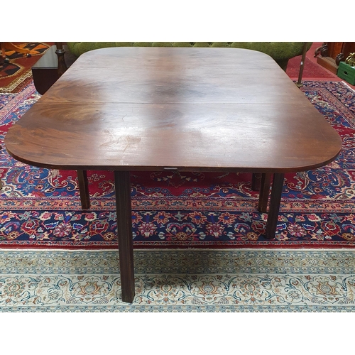 59 - A Georgian Mahogany dropleaf Table on square fluted supports. W 112 x 153 x H 71 cm approx.