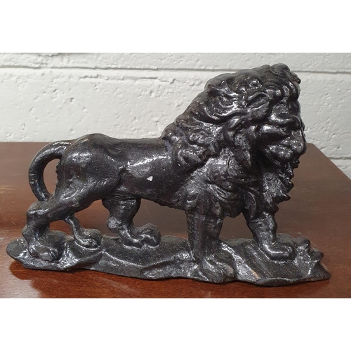 116 - A good pair of Cast Iron Doorstops depicting lions. L 22 x H 14 cm approx.