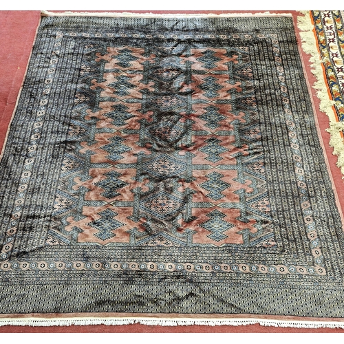 244 - A Pink ground Carpet with repeating central medallion design and multi borders. 304 x 250 cm approx.