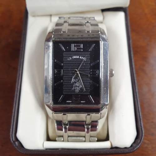 529 - A US Polo Assn Men's Black dial Watch in its original Box.