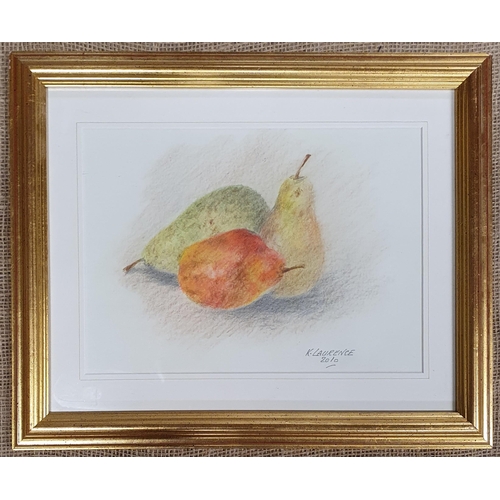 589 - K Laurence. A Watercolour of Pears on a table. Signed LR. In a good gilt frame. 21 x 28 cm approx.