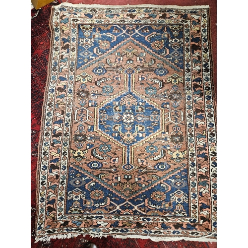 599 - A good Persian pink and cream ground Rug with central medallion design and multi borders. 141 x 104 ... 