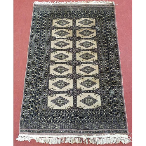 655 - A Persian Brown Rug with repeating medallion design. 200 x 129 cm approx. Worn in patches.