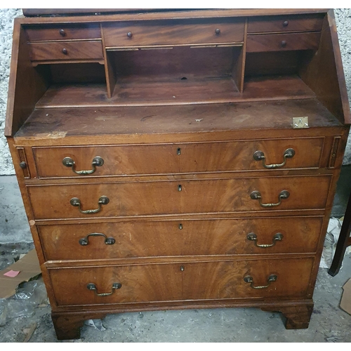 842 - A 19th Century Mahogany Bureau with flame grain fall flap and a fitted interior.