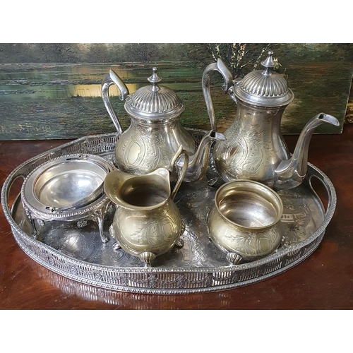 883 - A quantity of Silver Plate to include an oval Tray, Tea/Coffee set, letter Holder and other items.