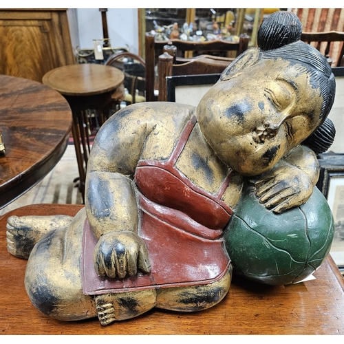 49 - A good Timber Buddha. H 36 x L 51 cm approx.