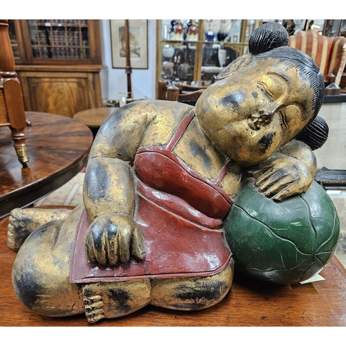 49 - A good Timber Buddha. H 36 x L 51 cm approx.