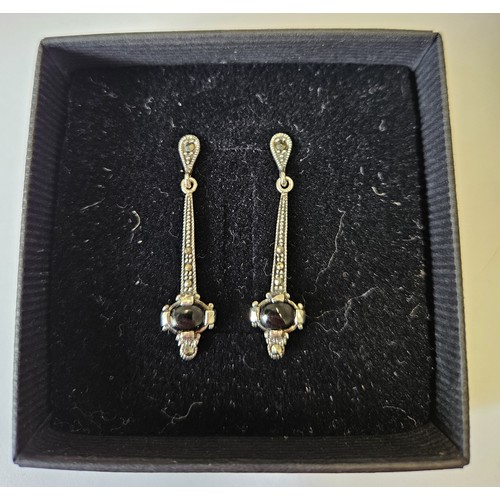 671 - A pair of Silver and Marcasite Earrings.