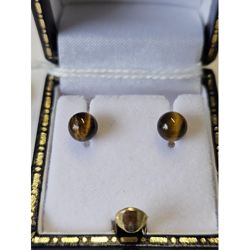 673 - A pair of Tigers eye Earrings.