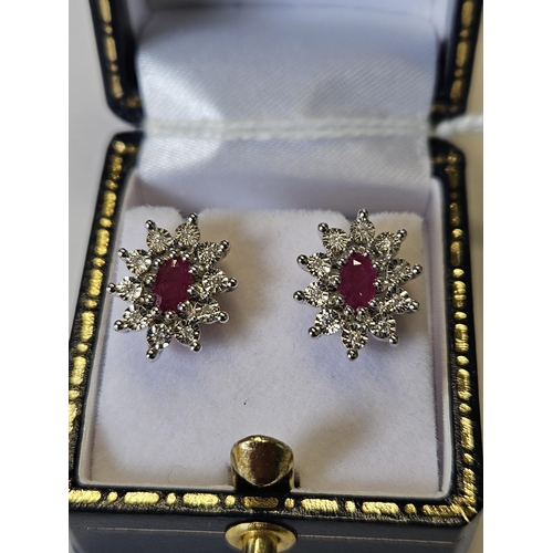 674 - A pair of 9ct Gold, Diamond and Ruby cluster Earrings.