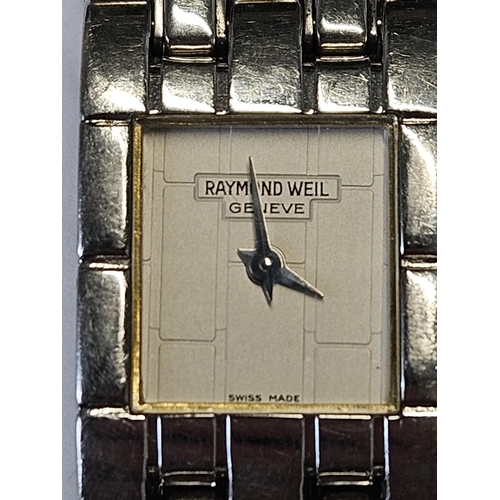 677 - A Reymond Weil ladies Swiss Geneva Watch, seems to be keeping good time and in working order ATO.