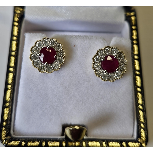 683 - A pair of 9ct Gold, Diamond and Ruby cluster Earrings.