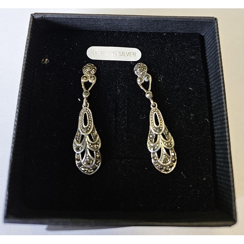 684 - A pair of Silver and Marcasite drop Earrings.