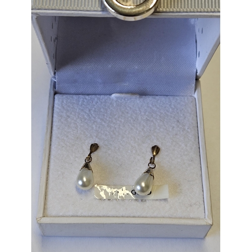 667 - A good pair of 9ct Gold and set pearl Earrings.