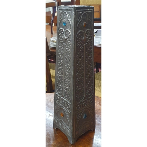 662 - A Liberty style early 20th Century obelisk shaped vase in the Arts and Crafts design. 
H 42 cm appro... 