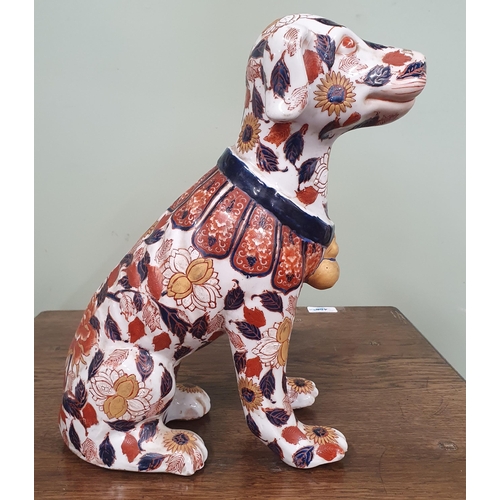 690 - A good early Oriental fire side Dog with hand painted detail in the Imari pattern.
H 36 cm approx.