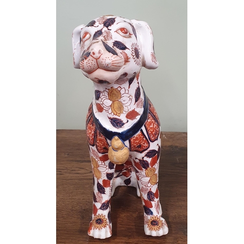 690 - A good early Oriental fire side Dog with hand painted detail in the Imari pattern.
H 36 cm approx.