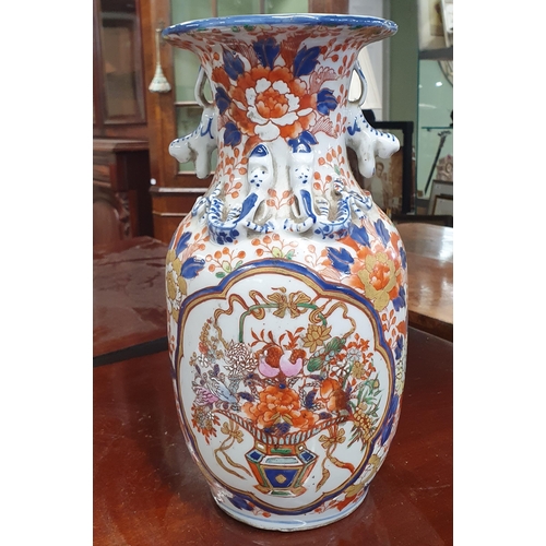 695 - A good early Oriental Vase with hand painted detail in the Imari pattern.
H 30 cm approx.