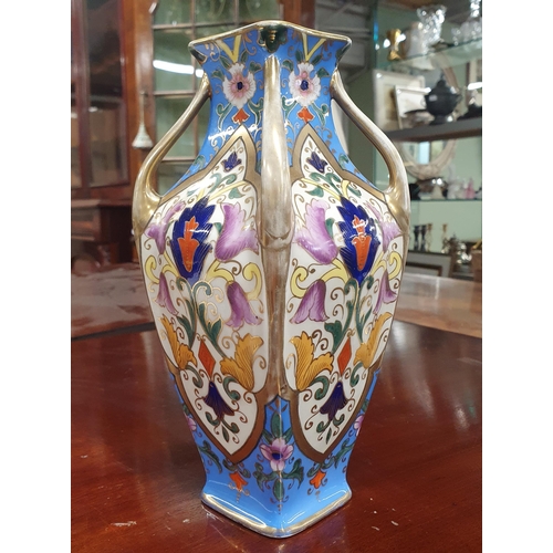 696 - An early Noritake Vase with hand painted panel decoration. H 21 cm approx.