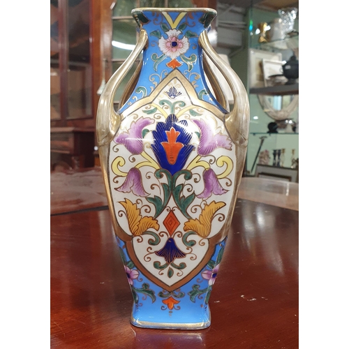 696 - An early Noritake Vase with hand painted panel decoration. H 21 cm approx.