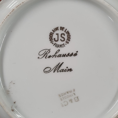 700 - A Fabulous Limoges Rehausse Main Dessert Service consisting of a large serving Bowl along with ten D... 