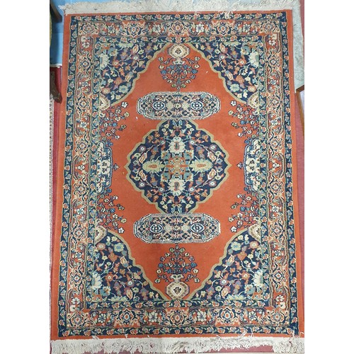 651 - A Red ground Rug with unique medallion design.
122 x 178 cm approx.