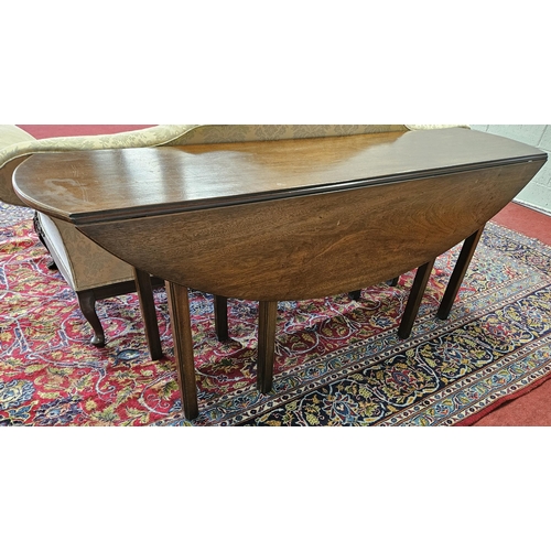 752 - A good Mahogany six foot Irish Hunting Table with drop sides and straight reeded supports.
H 75 x W ... 