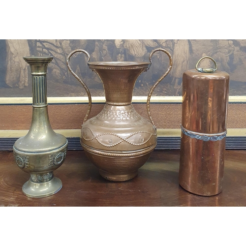 709 - A good late 19th Century hammered Copper urn shaped Vase along with a Brass example and a Copper wei... 