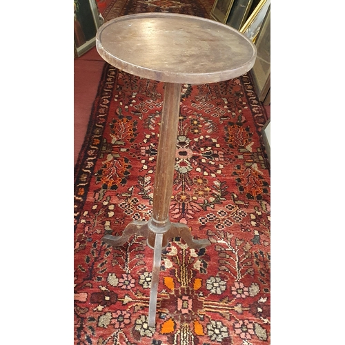 717 - A 19th Century Lamp Table on fluted tripod supports. H 66 x D 30 cm approx.