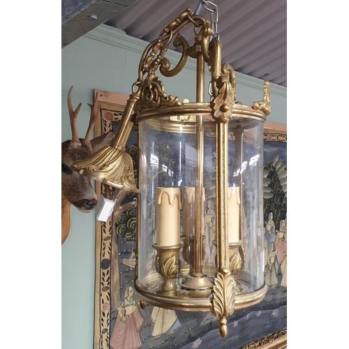 718 - A late 19th early 20th Century Brass hall Lantern with glass panels and a highly moulded outline.
L ... 