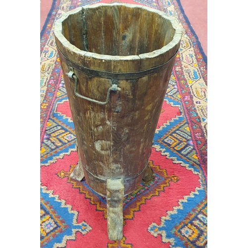 751 - A rustic hand carved timber stick Stand with metal banding. H 55 x D 24 cm approx.