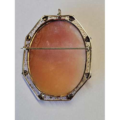 670 - A lovely 14ct Gold cameo Broach with filigree outline.