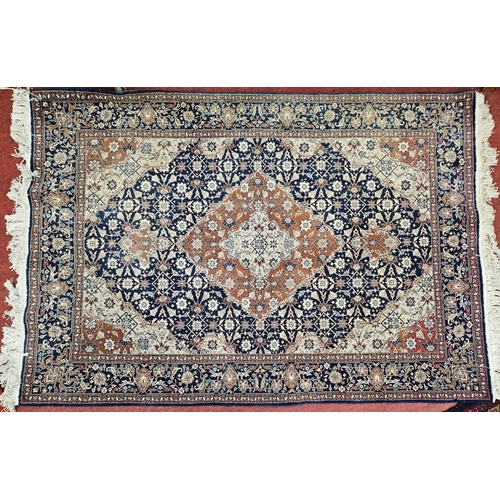 744 - A good Persian Blue ground Rug with multi borders and a unique central medallion design.
L 190 x W 1... 