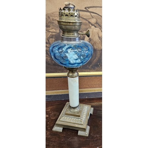 747 - A lovely 19th Century Brass and Glass Oil Lamp with Blue glass Bowl. H 42 cm approx.