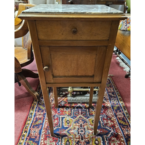 649 - An early 20th Century single door marble topped side Cabinet.