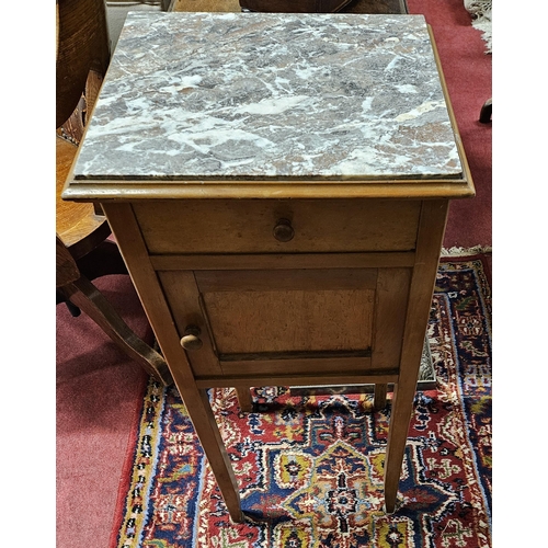 649 - An early 20th Century single door marble topped side Cabinet.