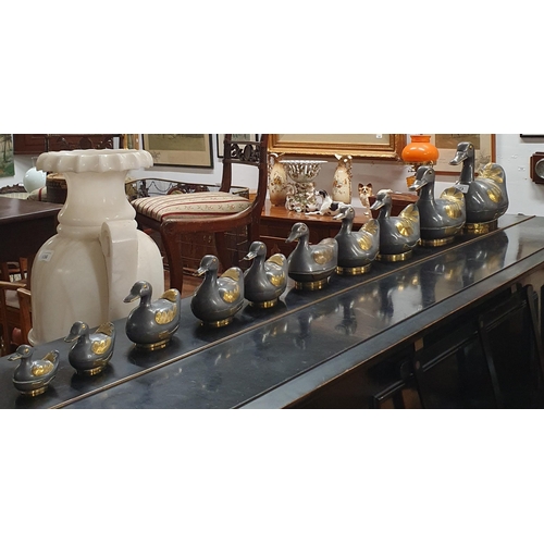 773 - A lovely graduated set of Pewter lidded Ducks with lids and set with Brass. Tallest H 21 x W 22 x D ... 