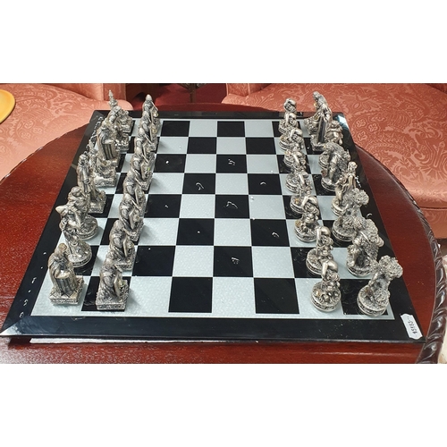 798 - A good metal and stone effect Tudor Mint Chess Set.  40 x 40 cm approx.