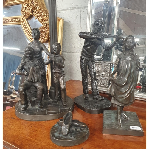 802 - A good group of Rhynhart Bronze effect Sculptures to include a table Lamp. Lamp H 50 cm approx.