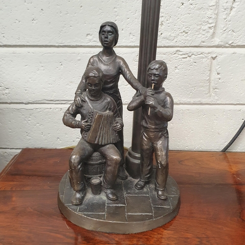 802 - A good group of Rhynhart Bronze effect Sculptures to include a table Lamp. Lamp H 50 cm approx.