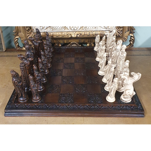 804 - A good stone effect chess Set. 34 x 34 cm approx.