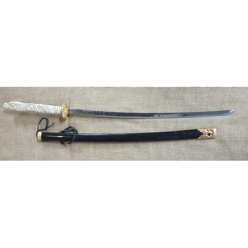 810 - Three Oriental prop Swords and Scabbards.
Largest L 114 cm approx.