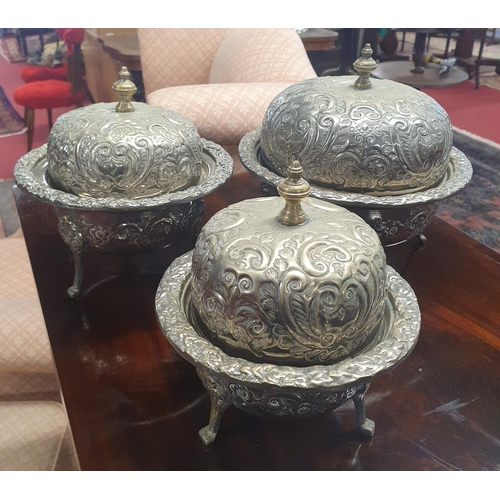 817 - A lovely set of three graduated serving Dishes with embossed lids.  Largest H 21 x D 22 cm approx.